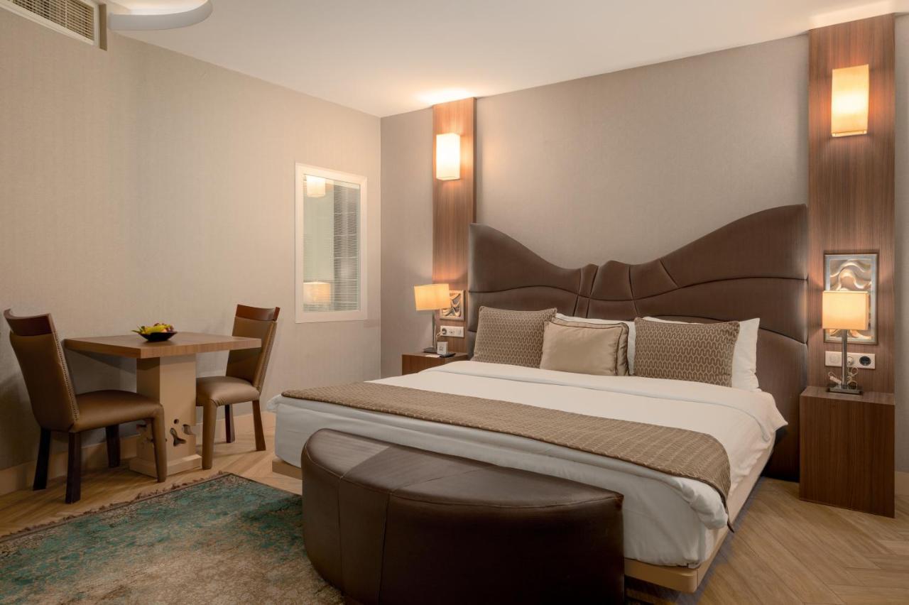 Titanic Hotel & Spa Sulaymaniyah Bagian luar foto A bedroom at the hotel