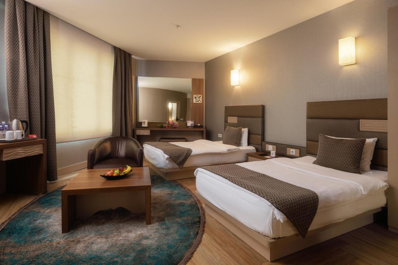Titanic Hotel & Spa Sulaymaniyah Bagian luar foto A room at the hotel